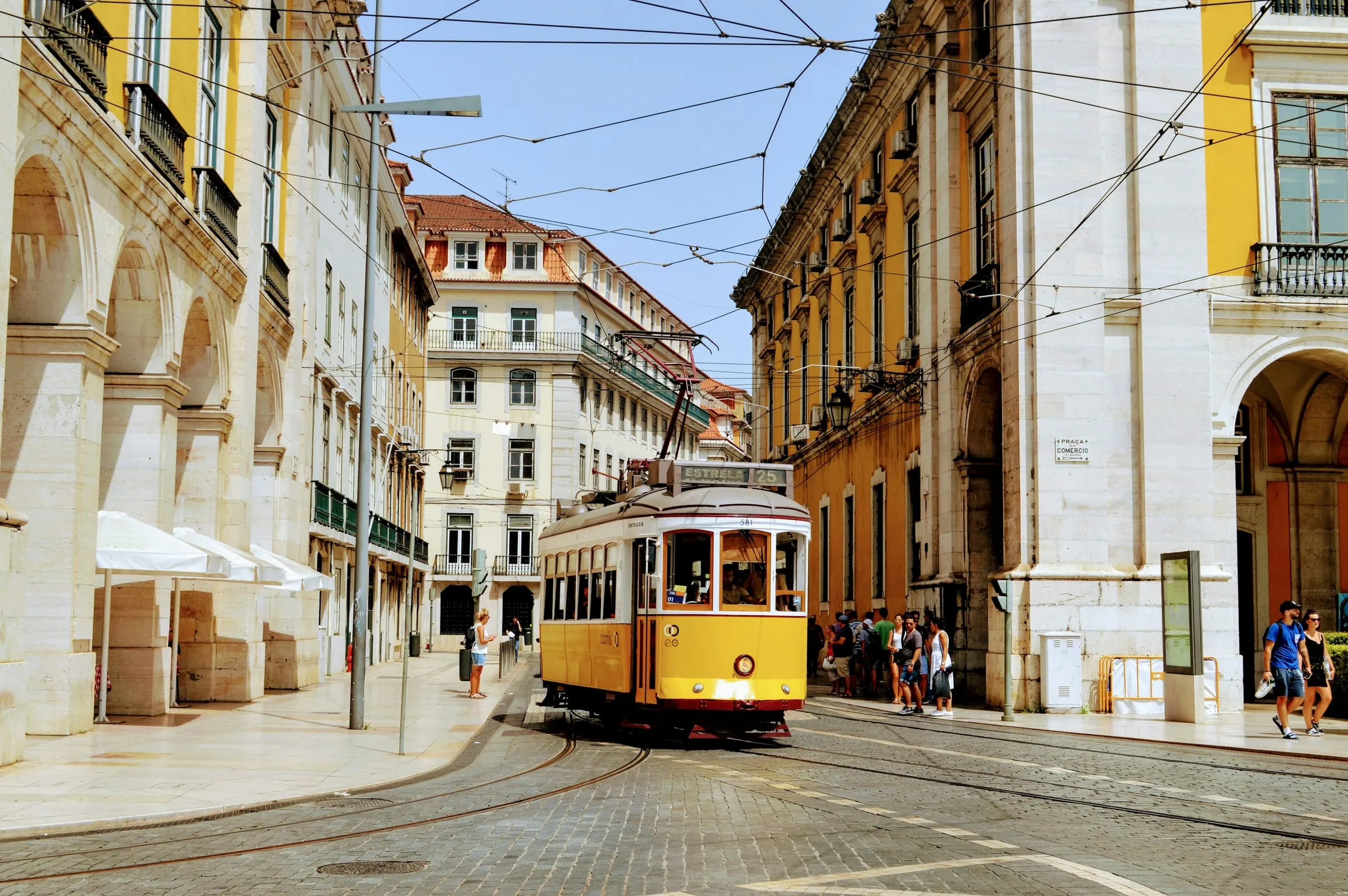 Yellow tram on a historic Lisbon street